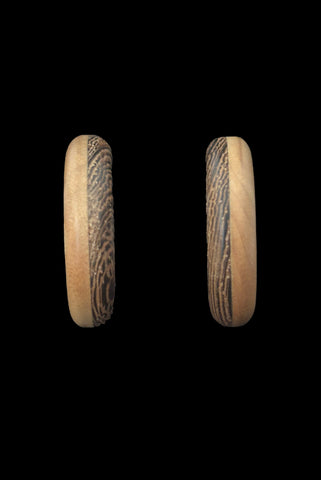 Vertical front view of 1980s vintage blonde and dark brown two tone wood hoop clip-on adjustable earrings.