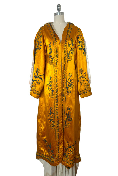 Front view of 1920s vintage mustard yellow and cream satin regalia robe w/ teal blue soutache embroidery, by Ihling Brothers Everard Co. Fits most sizes.