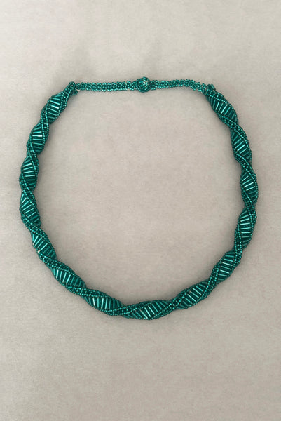 Vertical view of 1980s vintage teal glass seed and bugle bead twisted beadwork necklace.