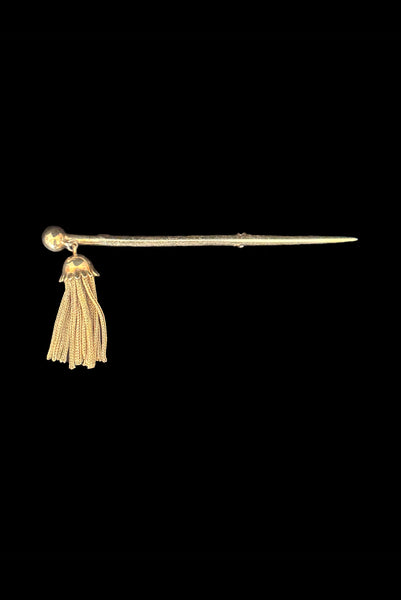 Vertical front view of 1960s vintage gold tone bar brooch with metal mesh tassel.