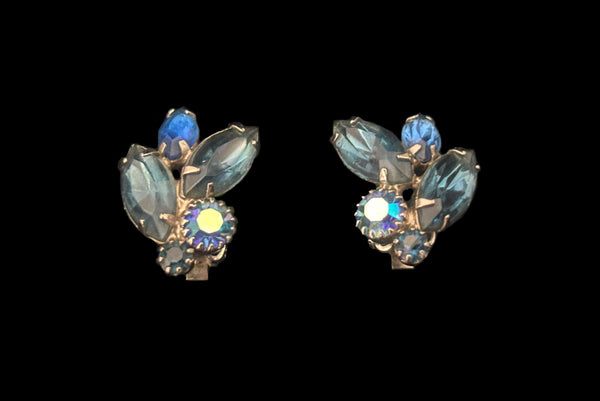 Horizontal front view of 1950s vintage blue and iridescent, round and marquise rhinestone and silver tone clip-on earrings by Weiss.