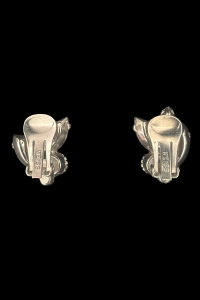 Vertical back view of 1950s vintage blue and iridescent, round and marquise rhinestone and silver tone clip-on earrings by Weiss.