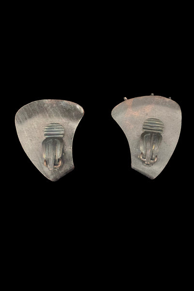 Vertical back view of 1960s vintage darkened copper and iridescent marquise rhinestone botanical cattail clip-on earrings.