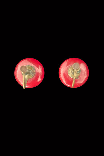 Vertical back view of 1930s vintage red Bakelite round button screw back earrings.