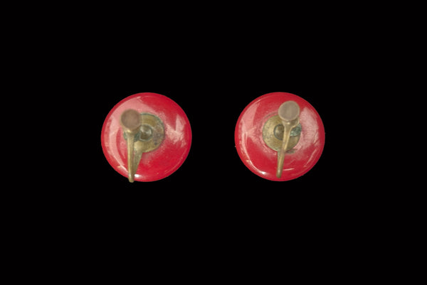 Horizontal back view of 1930s vintage red Bakelite round button screw back earrings.