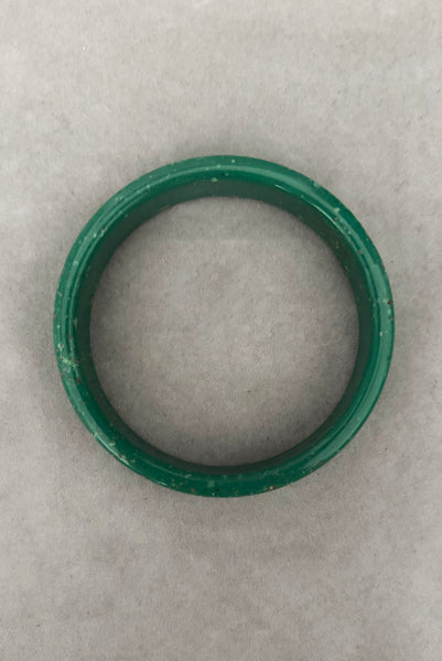 Vertical bottom view of 1960s vintage green and white mottled textured two (2) sliced bangle bracelet set. Showing a single bangle.