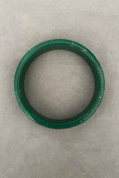 Vertical bottom view of 1960s vintage green and white mottled textured two (2) sliced bangle bracelet set. Showing a single bangle.
