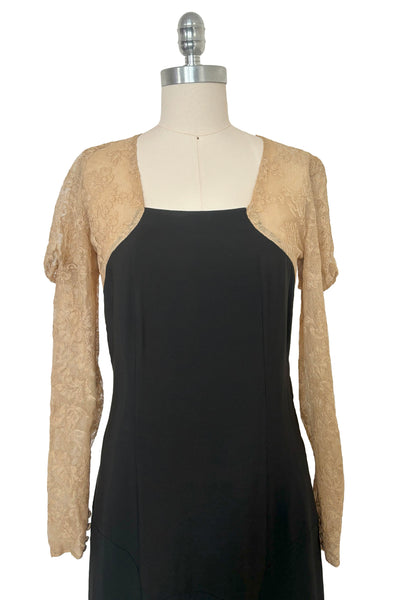 Bodice front view of 1930s vintage cream lace sheer back Juliet sleeve square neck black crepe midi dress, size extra small to small.