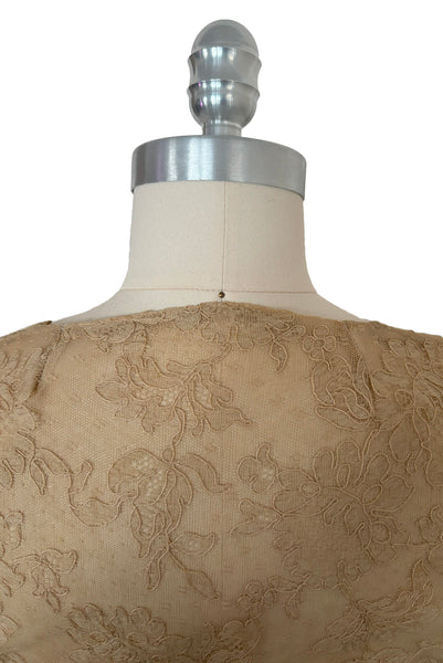 Detail view of 1930s vintage cream lace sheer back Juliet sleeve square neck black crepe midi dress, size extra small to small. Showing two small darts taken in the neckline of the sheer back to repair some damage.