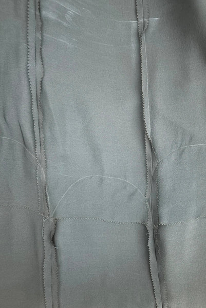 Interior detail view of 1930s vintage cream lace sheer back Juliet sleeve square neck black crepe midi dress, size extra small to small. Showing the arched seaming on the skirt.