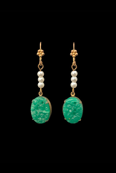 Vertical front view of 2010s vintage oval green floral pressed glass cabochon and white faux pearl gold tone lever back pierced earrings. Made from vintage components.