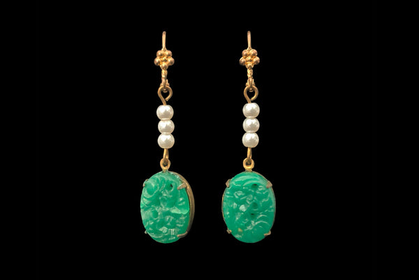 Horizontal front view of 2010s vintage oval green floral pressed glass cabochon and white faux pearl gold tone lever back pierced earrings. Made from vintage components.