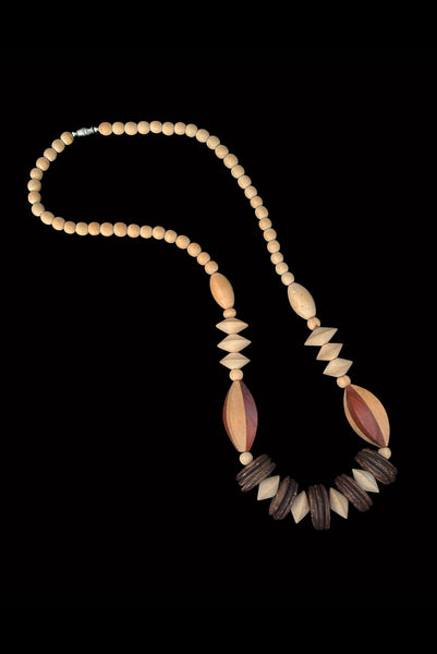 Vertical view of 1980s vintage carved round and disk bead light, medium, and dark triple tone wood necklace.