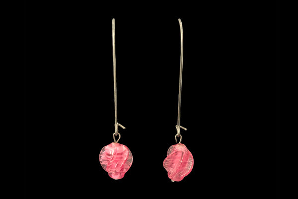 Horizontal front view of 2010s pink glass lampwork bead on long silver tone earwire pierced drop earrings. Made from vintage components.