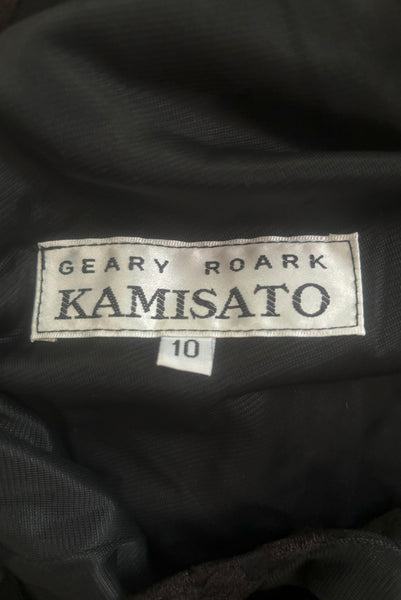 Detail view of new with tags 1990s vintage Art Deco style black floral burnout velvet knit maxi dress, by Kamisato, small to medium. Showing the label and size 10 tag.