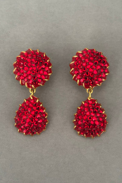 Vertical front view of 1990s vintage red rhinestone & enamel, gold tone top and drop clip-on statement earrings.