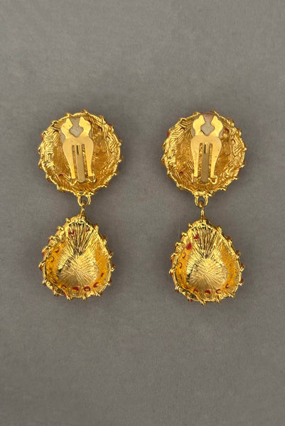 Vertical back view of 1990s vintage red rhinestone & enamel, gold tone top and drop clip-on statement earrings.