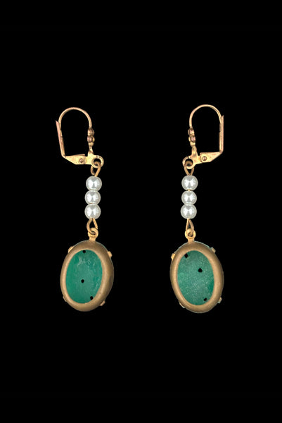 Vertical back view of 2010s vintage oval green floral pressed glass cabochon and white faux pearl gold tone lever back pierced earrings. Made from vintage components.