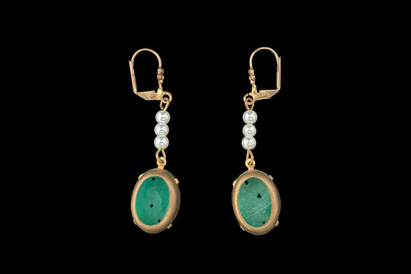 Horizontal back view of 2010s vintage oval green floral pressed glass cabochon and white faux pearl gold tone lever back pierced earrings. Made from vintage components.