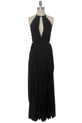 Front view of vintage new with tags 1970s split front black jersey evening dress by Roter Couture, medium to large. Showing the revealing split halter neckline, and draped skirt.