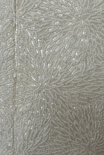 Back detail view of 1990s vintage cream beaded satin halter neck & black velvet evening dress by Carmen Marc Valvo, extra small to small. Showing the densely beaded top of cream glass seed and cut beads.