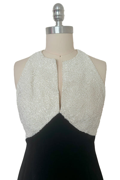 Bodice front view of 1990s vintage cream beaded satin halter neck & black velvet evening dress by Carmen Marc Valvo, extra small to small. Showing the densely beaded top of cream glass seed and cut beads.