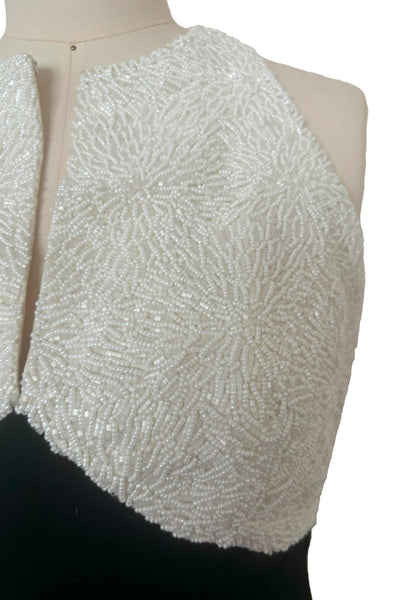 Bodice detail view of 1990s vintage cream beaded satin halter neck & black velvet evening dress by Carmen Marc Valvo, extra small to small. Showing the densely beaded top of cream glass seed and cut beads.