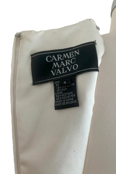 Interior detail view of 1990s vintage cream beaded satin halter neck & black velvet evening dress by Carmen Marc Valvo, extra small to small. Showing the Carmen Marc Valvo label and size 4 tag.