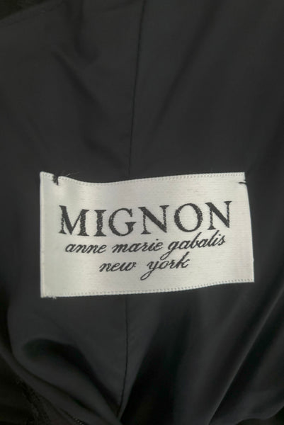 Interior detail view of 1980s vintage black satin, sequin lace, & dotted tulle asymmetrical cocktail dress by Mignon, small to medium. New with tags. Showing the Mignon Anne Marie Gabalis New York label.