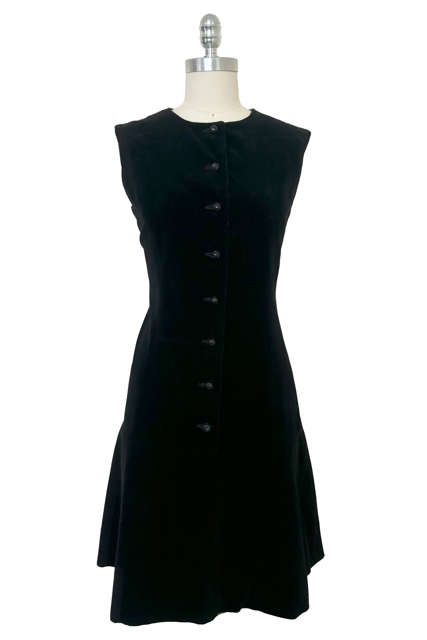 Front view of 1960s vintage black velveteen rhinestone button front drop waist jumper dress, small to medium.