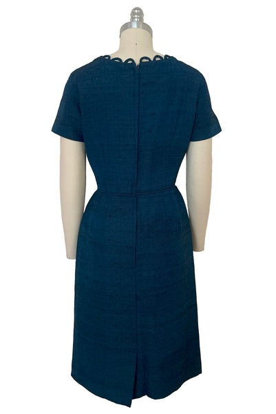 Back view of 1950s vintage sapphire blue and black raw silk scalloped scoop neck, short sleeve, pencil skirt cocktail dress, size small to medium.