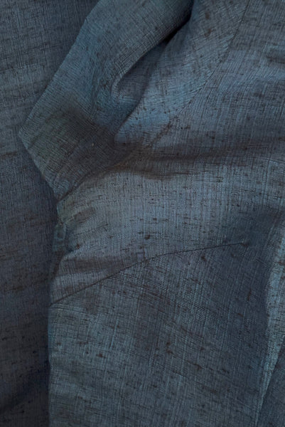 Detail view of 1950s vintage sapphire blue and black raw silk scalloped scoop neck, short sleeve, pencil skirt cocktail dress, size small to medium. Showing light discoloration at the under arms.