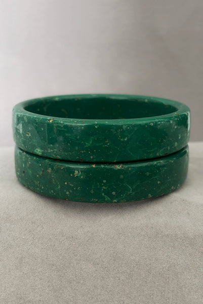 Vertical front view of 1960s vintage green and white mottled textured two (2) sliced bangle bracelet set. Showing the pair of bangles together.