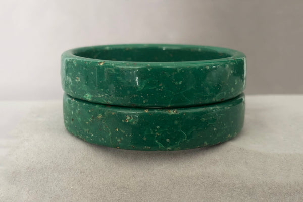 Horizontal front view of 1960s vintage green and white mottled textured two (2) sliced bangle bracelet set. Showing the pair of bangles together.