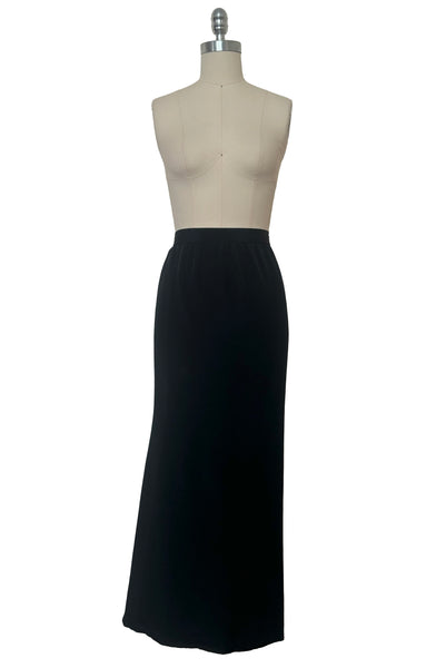 Front view of 1990s vintage black silk maxi evening skirt with train by Fernando Pena, size extra small to small.