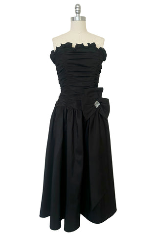 Front view of vintage 1980s black taffeta ruffled strapless dress with full skirt and rhinestone trim by Nadine Formals, extra small to small.