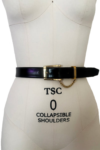 Front view of 1990s vintage black leather and gold chain buckle designer belt by Ellen Tracy, size extra small to small.
