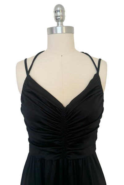 Bodice front view of vintage 1970s black knit strappy maxi dress, extra small to small. Showing the multiple straps, and gathered sweetheart bodice.
