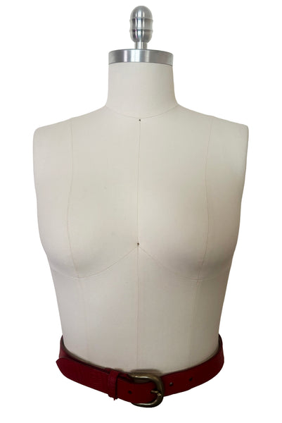 Front view of 1980s vintage designer red stamped Italian leather belt  with brass buckle by Furla, size medium to large. Made in Italy.