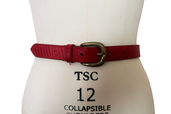 Front view of 1980s vintage designer red stamped Italian leather belt  with brass buckle by Furla, size medium to large. Made in Italy.