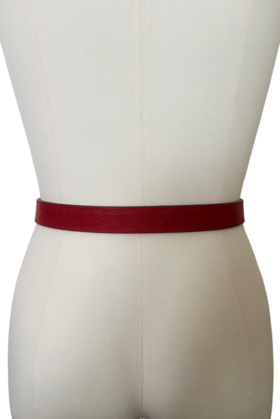Back view of 1980s vintage designer red stamped Italian leather belt  with brass buckle by Furla, size medium to large. Made in Italy.
