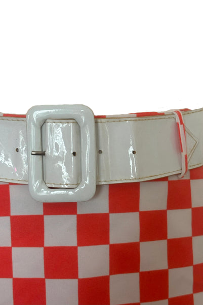 Front detail view of 1990s does 1960s vintage Mod orange and white checkered micro mini skirt with white belt by Gozzi, small to medium. Showing the white plastic patent belt.