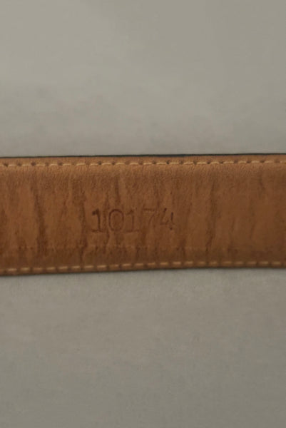 Interior detail view of 1990s vintage black leather and gold chain buckle designer belt by Ellen Tracy, size extra small to small. Showing a serial number stamp.