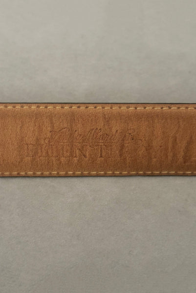 Interior detail view of 1990s vintage black leather and gold chain buckle designer belt by Ellen Tracy, size extra small to small. Showing the Ellen Tracy stamp.