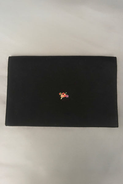 Vertical back view of 1930s vintage black satin clutch with pink, blue, green, purple, and gold floral chainstitch embroidered clutch by Denis Francet.