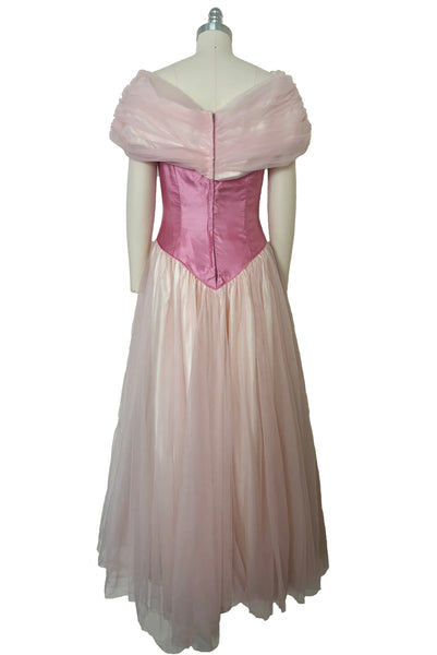 Back view of 1980s vintage pink satin and tulle off the shoulder bridesmaids dress, small to medium. Princess style gown.