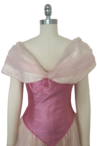 Bodice front view of 1980s vintage pink satin and tulle off the shoulder bridesmaids dress, small to medium. Princess style gown. Showing the wide tulle collar, and dark pink pointed bodice.