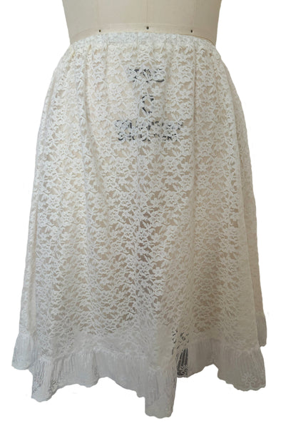 Front view of 1990s vintage sheer white floral lace elastic waist skirt, extra small to medium.