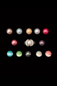 Vertical top view of 1990s vintage 925 rhodium plated sterling silver and rhinestone interchangeable orb ring and thirteen (13) orbs set, Size 7.5.