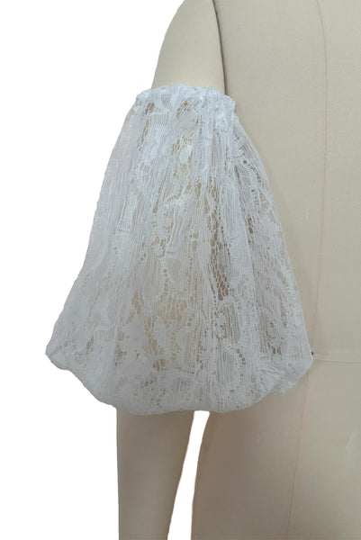 Back detail view of 1990s vintage sheer white lace and elastic detachable puff sleeves, one size.